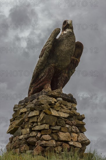 Stone eagle along the road