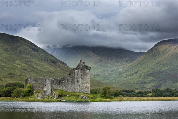 Rain clouds over Kilchurn Castle ruins on Loch Awe