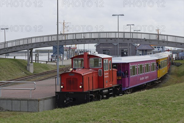 Island train leaves station at harbour
