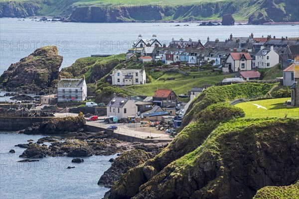 The fishing village of St Abbs seen from the south side of St Abb's Head