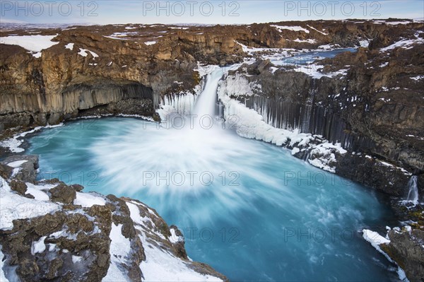 Aldeyjarfoss waterfall by the SkjsslfandafljÂ¾t river in winter in the north-eastern region