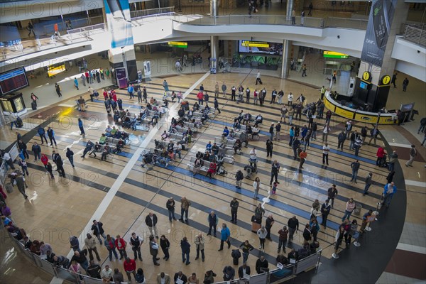 O. R. Tambo International Airport hall with waiting greeters