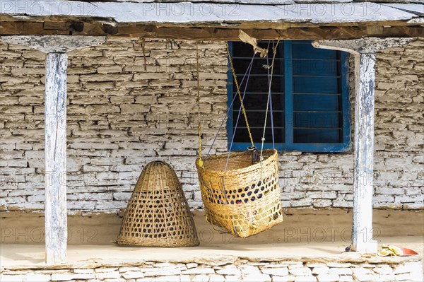 Cradle hanging in front of a house