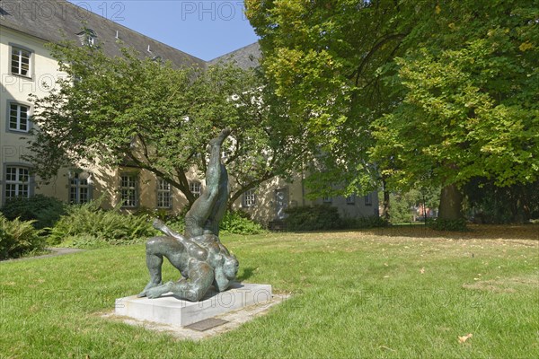 Wrestler sculpture in front of former Franciscan monastery