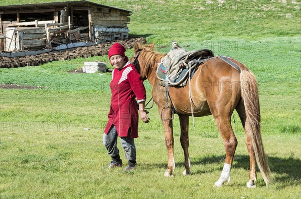 Kyrgyz woman with horse