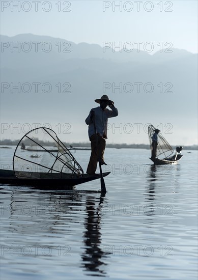 Legwork Intha fishermen with traditional conical nets