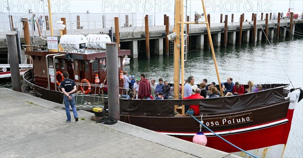 Cutter with tourists in the harbour of List