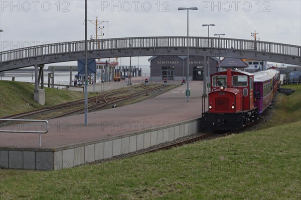 Island train leaves station at harbour