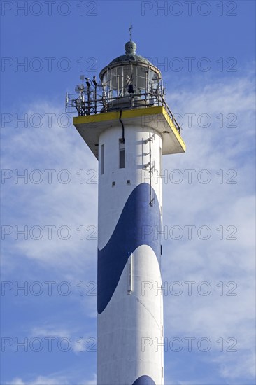 Lantern of the white-blue lighthouse Lange Nelle in the harbour of Ostend at the Belgian North Sea coast