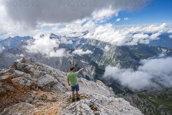 Hiker points into the distance