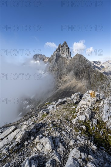 View of the solid cloud-covered summit and ridge of the Partenkirchner Dreitorspitze