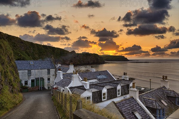 View of residential houses and hotel by the sea