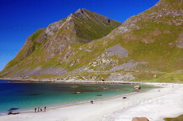 People on a wide sandy beach