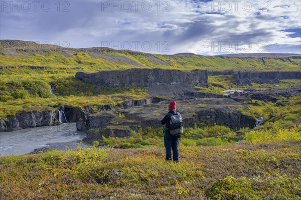 Woman looking towards the Katlar narrows of Joekulsa A Fjoellum