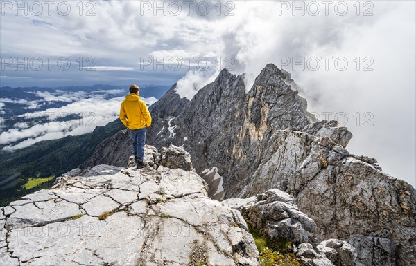 Hiker at the summit of the Westliche Toerlspitze