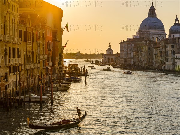 Gondoliers in the Grand Canal at sunrise