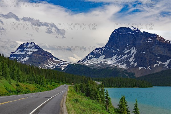 Road leads along a turquoise lake