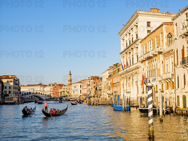 Gondolas next to historic house facades in the Grand Canal