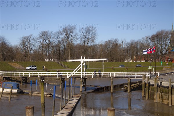 The old historic white bridge over the Toenning peat harbour