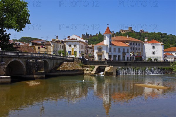 Renaissance bridge of Velha over the river Nabao and Templar Castle of Christ in the background