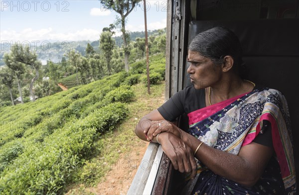 Woman looking out of train window