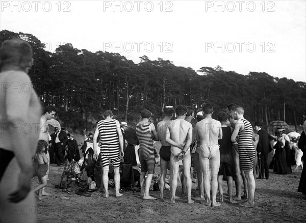 Group with bathers on the beach