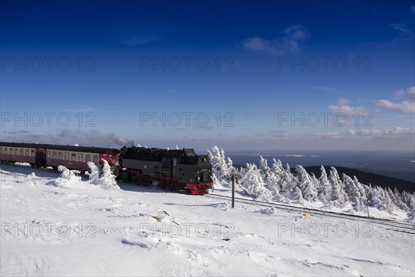 Narrow-gauge railway Brockenbahn on summit in front of Brocken station