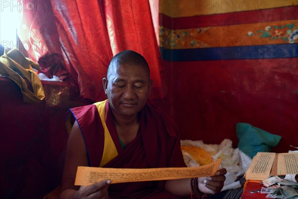 Monk in the prayer room