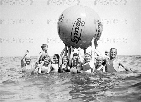 Group with bathers on the beach