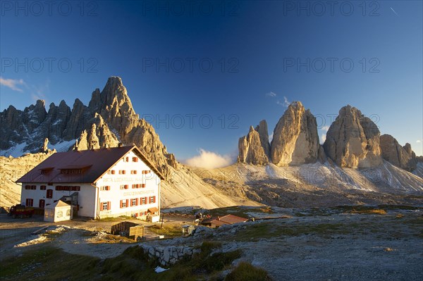 Three Peaks Hut and Chapel in front of Parternkofel and north faces of the Three Peaks