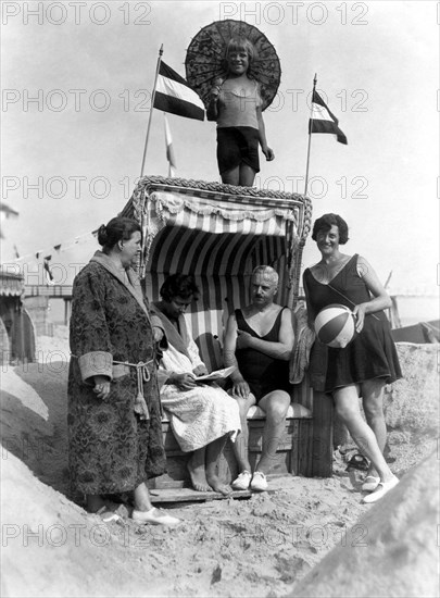 Group with bathers on the beach