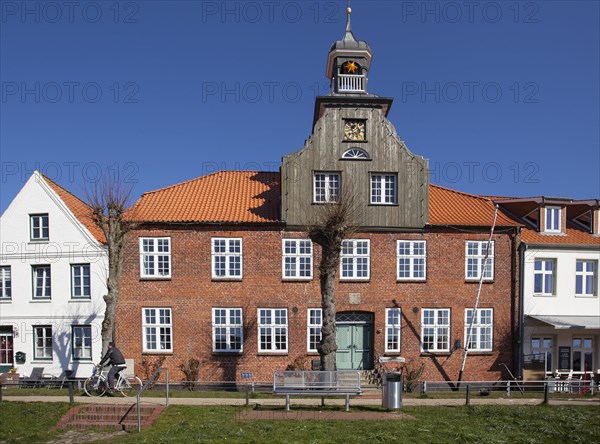 Old historic half-timbered house at the old historic harbour of Toenning