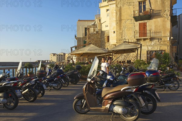 Vespas on the outskirts of the old town of Cefalu