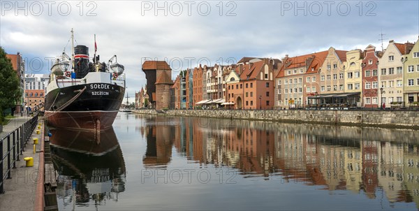 The old town of Gdansk with the first tanker built at the Gdansk shipyard