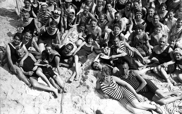 Group with bathers on the beach