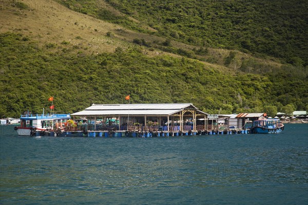 Floating houses in front of Ho Ca Tri Nguyen Island