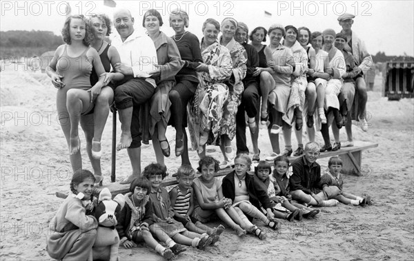 Group with bathers on the beach