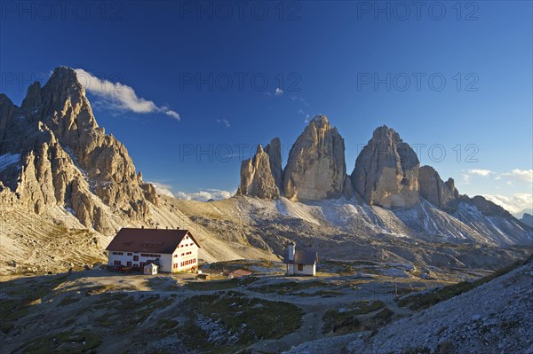 Three Peaks Hut and Chapel in front of Parternkofel and north faces of the Three Peaks