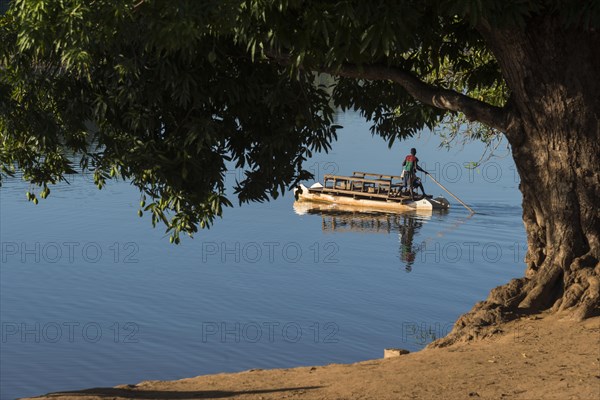 Passenger ferry at Manambolo under mango tree