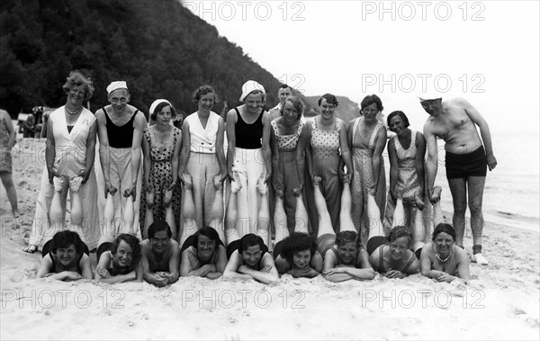 Group with bathers on the beach