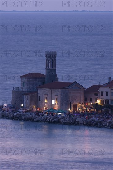 Lighthouse at the harbour entrance of Piran