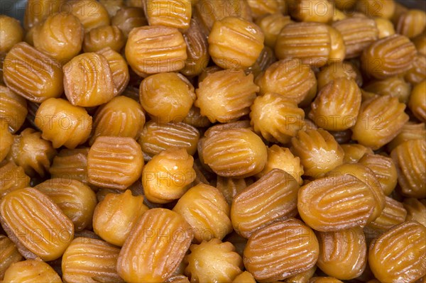 Deep-fried puff pastry dipped in syrup. In Turkish named as Tulumba tatlisi