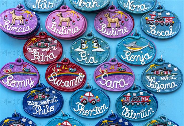 Colourful and decorative ceramic name badges