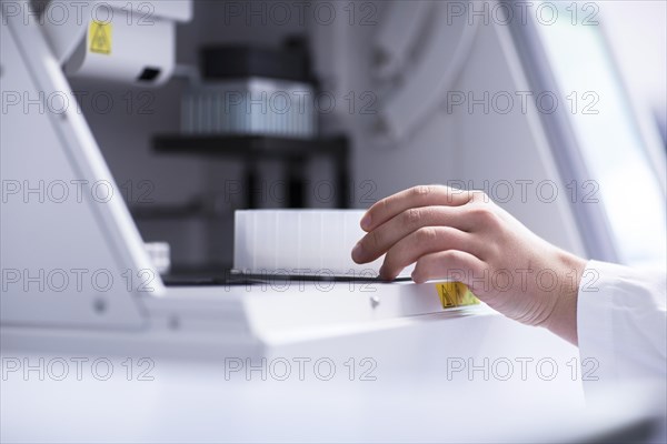 Multiple samples in the hand of a laboratory assistant