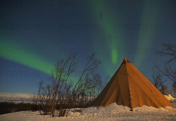 Tent in wintry landscape