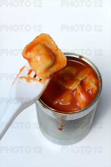 Ravioli in tin and plastic fork