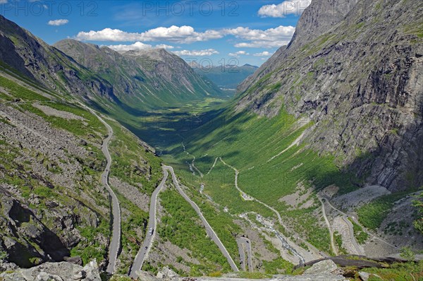 Mountain road winds up the mountain in serpentines