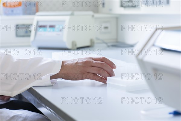 Multiple samples in the hand of a laboratory technician on the laboratory table in the Freiburg laboratory