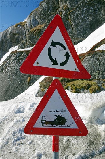 Traffic sign with roundabout and snowmobile