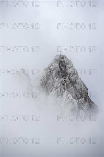 Summit in clouds and fog